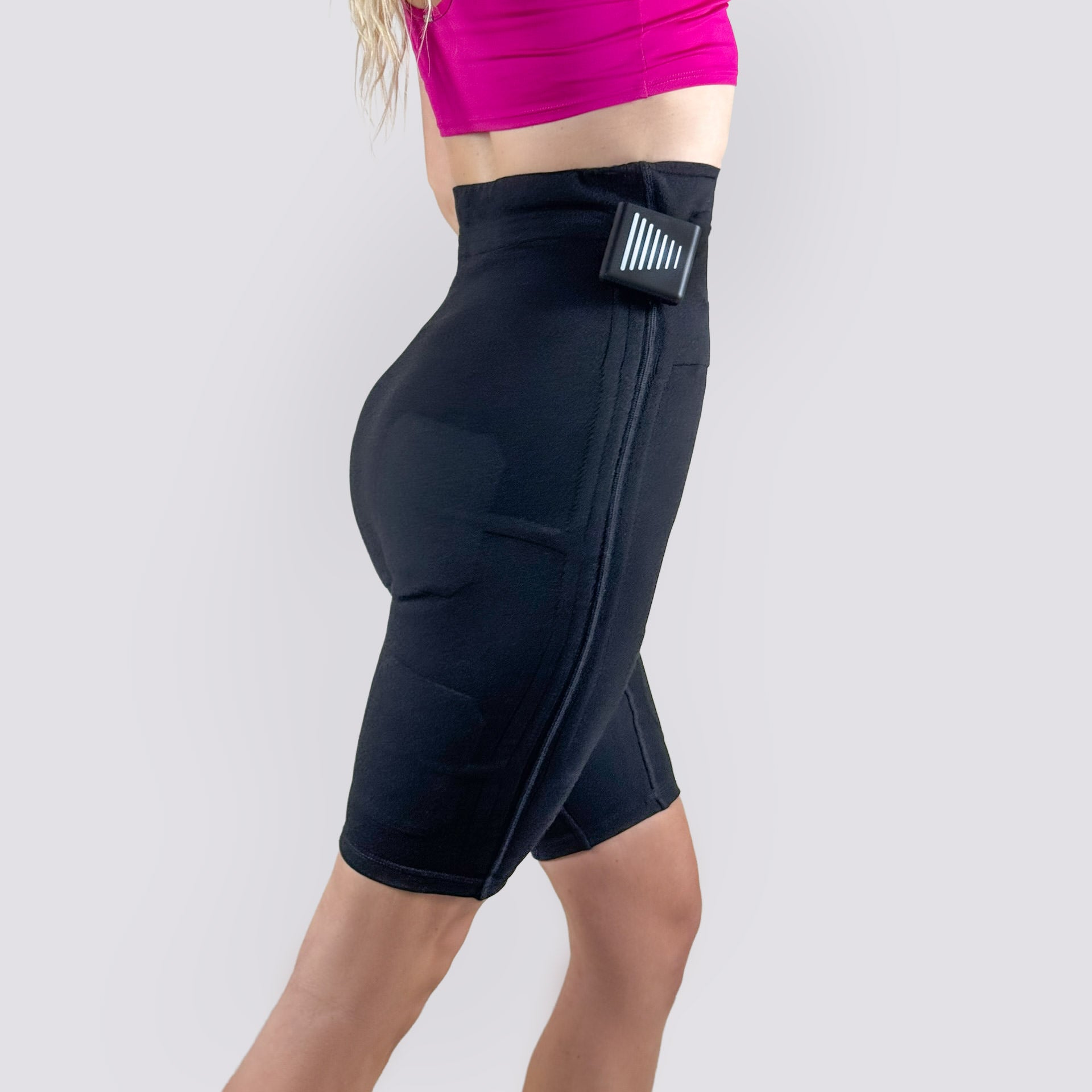 Side view of EMS PRO ONE women's EMS shorts with control box attached at the waistband