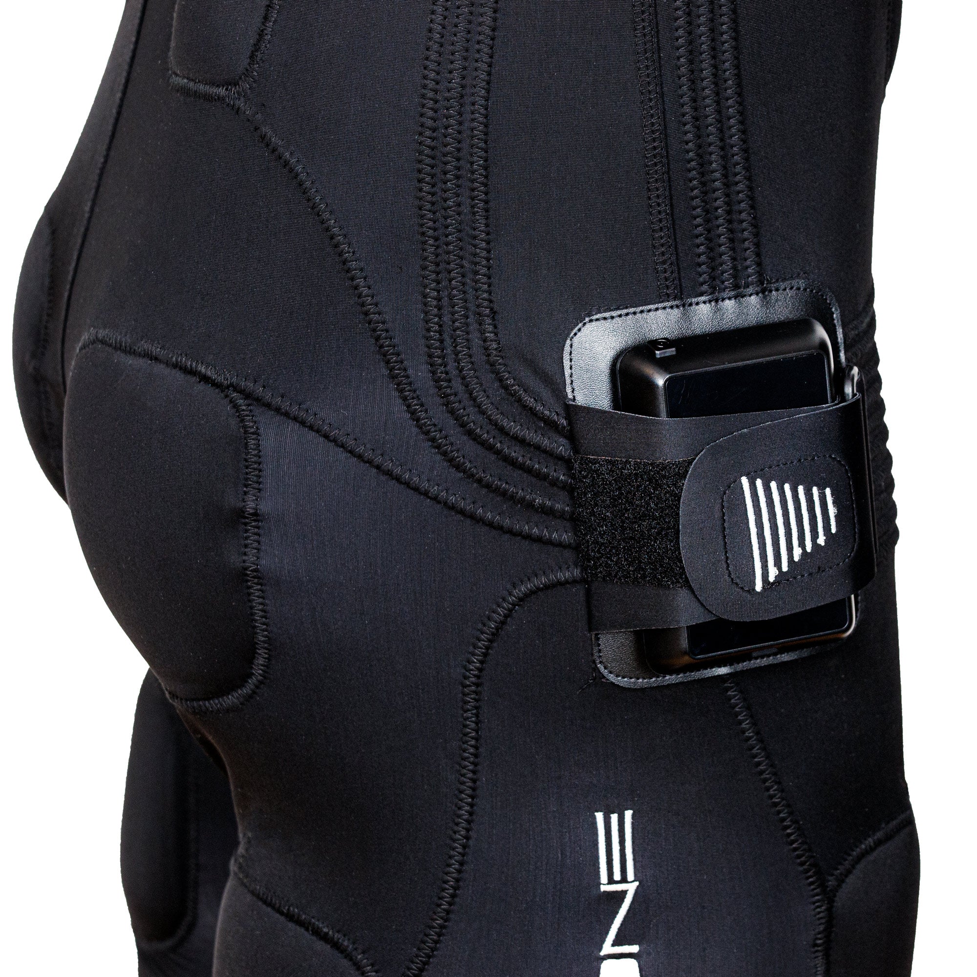 Close-up of black EMS suit with control unit strapped at hip and white triangular logo